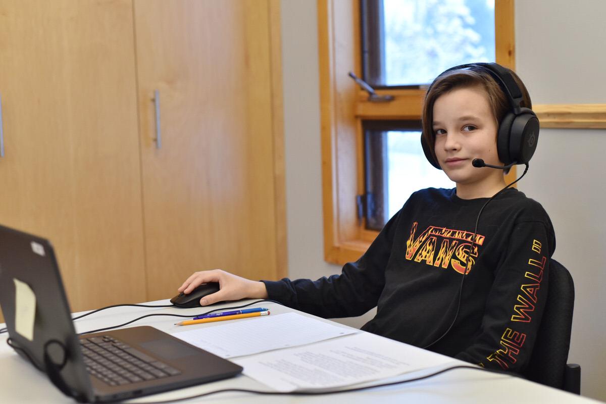 student-using-computer-for-montessori-model-united-nations.jpg student-using-computer-for-montessori-model-united-nations.jpg